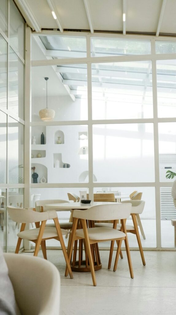 Elegant modern dining room with wooden furniture and bright natural lighting in Yalova, Türkiye.