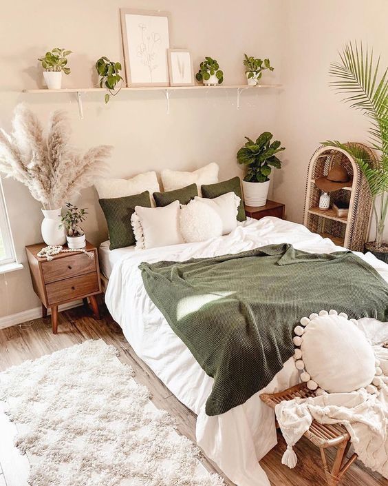 Cozy bedroom decorated with warm lighting, layered bedding, and neutral color palette for a calming atmosphere.”