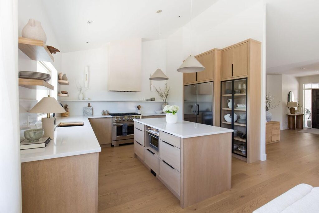 Modern Japandi-style kitchen with warm wood cabinets, minimalist design, and soft natural lighting — trending kitchen look for 2025